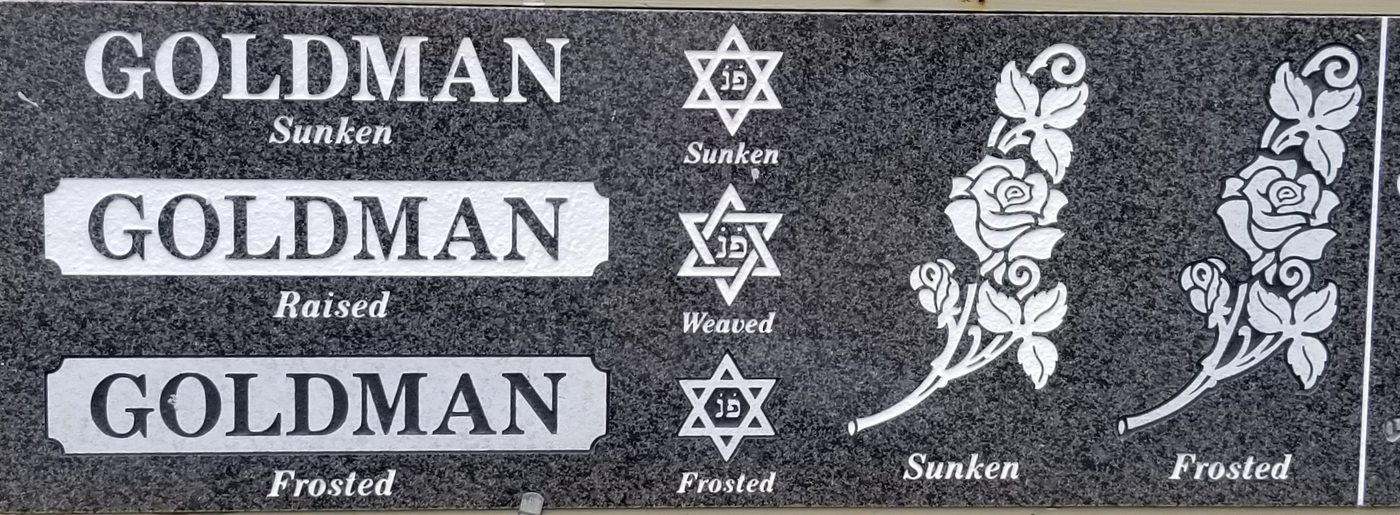 A shop sample board showing the same name and emblems in sunken, raised and frosted finishes