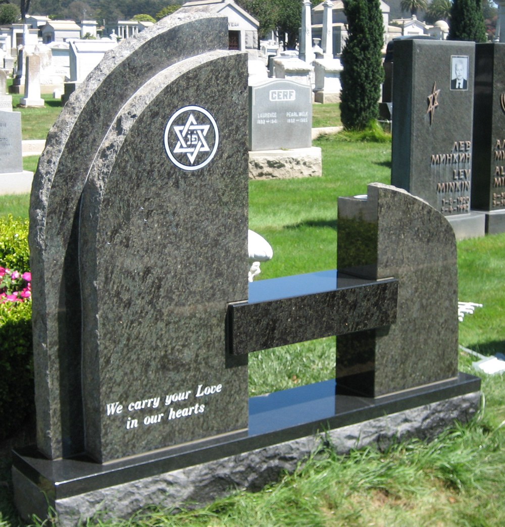 A custom monument with a curved form and a rough-hewn outer edge